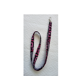 Zebra print lanyard with pink accents on a white background